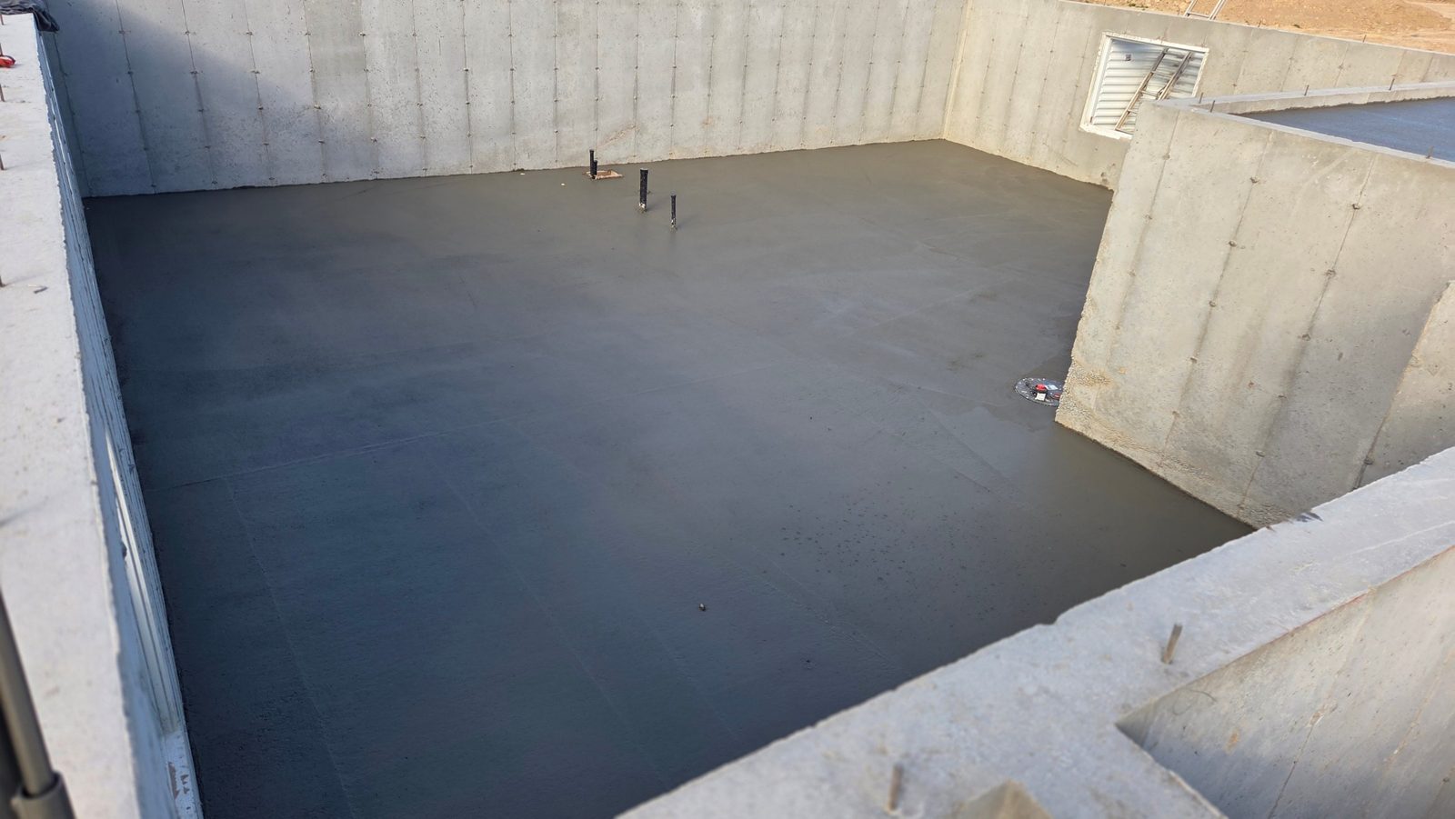 Fresh basement slab pour at the Summit home in Chubbuck, Idaho