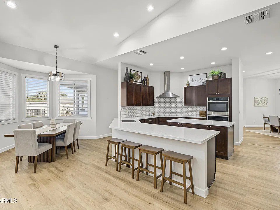 Kitchen with large island and dining area in the Quartz estate