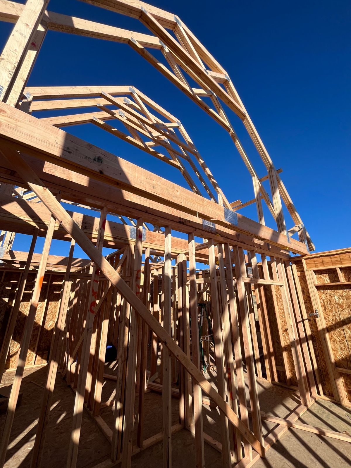 Roof trusses seen from inside the framed home